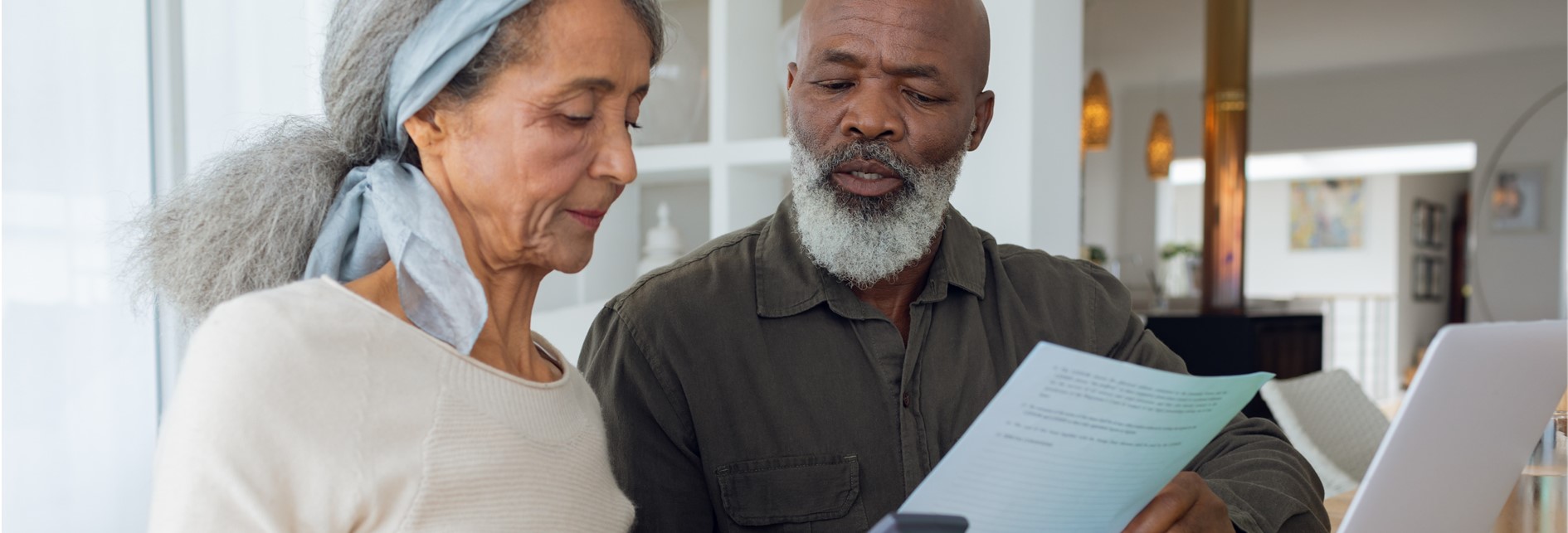 a man and a woman looking at some paperwork